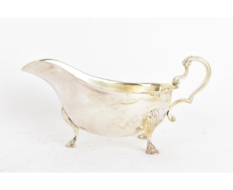 An Edwardian silver saucer boat, by Fenton Brothers Ltd, hallmarked Sheffield 1903, of oval form with a shaped rim and scroll