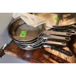 Seven sauté pans