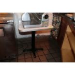 Single pedestal table with Formica top, 30" x 24"