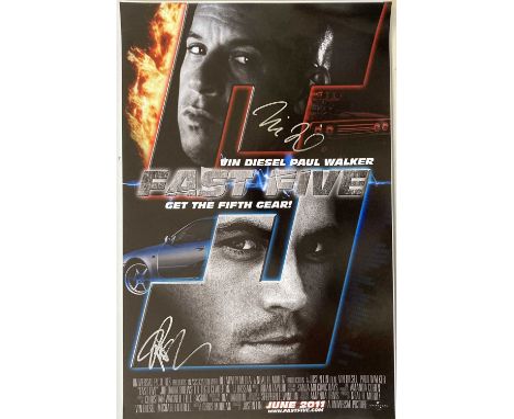 A photo print depicting a cinematic poster for 'Fast Five' (11 x 17") signed in silver ink by Paul Walker and Vin Diesel.