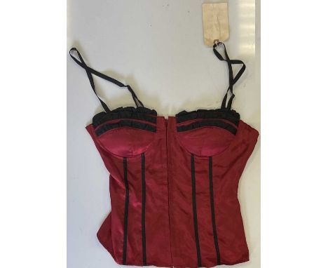 A red corset from the 2006 'Confessions' tour. With 'Unique Props' COA.  Very good condition.