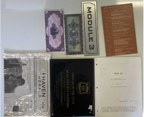 An assortment of props and ephemera to include: Kyle XY original script, a wall plaque from 'Reaper', a 'Haven Herald' newspa
