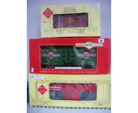 Three 'G' Scale American Outline Rolling Stock, boxed Bachmann 'Dairy Experts' box van, Aristocraft Caboose and N.Y.C box car