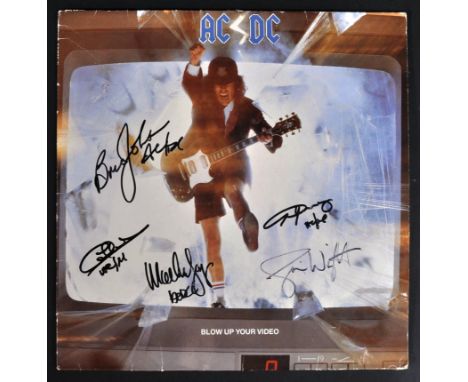 ACDC - a scarce full-band autographed vinyl record LP album ' Blow Up Your Video '. Signed by all members - Brian Johnson, An
