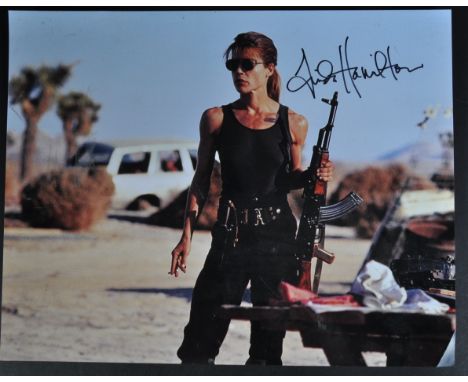Linda Hamilton - American Actress - Terminator - an autographed 14x11" colour photograph of Hamilton as Sarah Connor from the