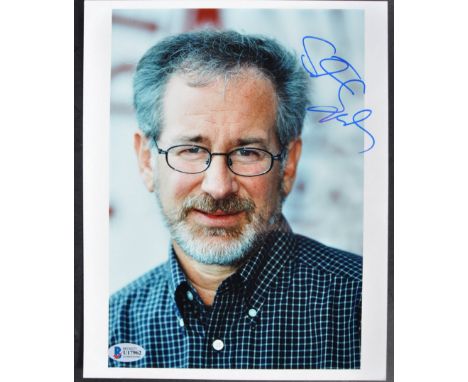 Stephen Spielberg - Director - a scarce autographed 8x10" colour photograph of Spielberg. Signed neatly in blue ink to a ligh