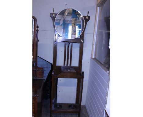 A vintage oak hall stand with later mirror attached, shipping unavailable 