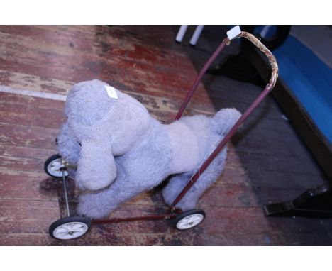 A vintage child's push a long toy dog, shipping unavailable 