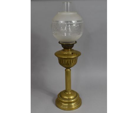 An Early 20th Century Brass Oil Lamp with ribbed Column Support, 70cms High Overall 