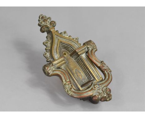 A Brass Door Knocker in the form of a Gothic Arched Doorway 20cms High 