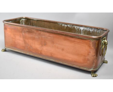 A Mid 20th Century Rectangular Copper Plant Trough with Brass Lion Maks and Ring Handles and Brass Claw Feet, 39cms Wide 