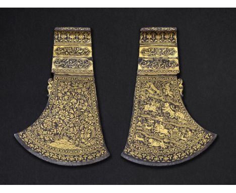 A fine gold-inlaid steel axe head signed by Muhammad Sadiq bin Muhammad Ya'qub India, 18th Centuryof typical form, decorated 