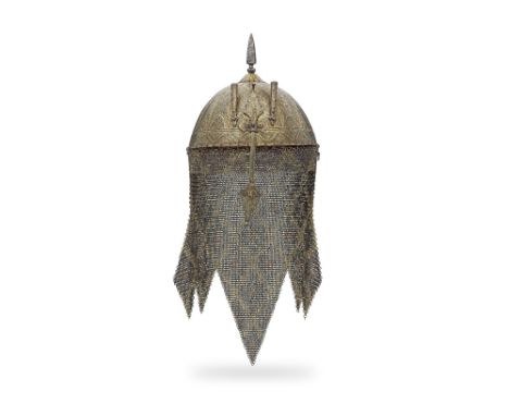 A gold koftgari steel helmet India, 19th Centuryof gadrooned domed form with inverted floral finial surmounted by a faceted s