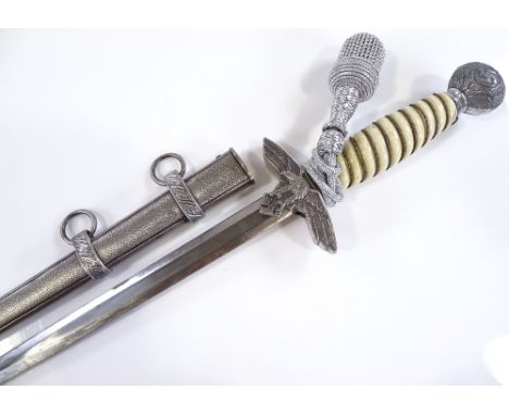 A German Second War Period Luftwaffe dagger, composition grips and nickel plate mounts, with original scabbard 