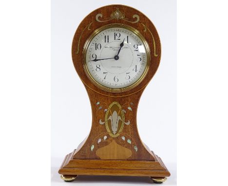 An Art Nouveau mahogany balloon-cased mantel clock, with inlaid brass and mother-of-pearl marquetry, by Goldsmiths &amp; Silv
