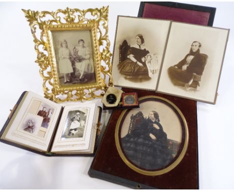 A group of 19th century photographic family portraits, 1 mounted in a 19th century carved giltwood Florentine frame, height 2