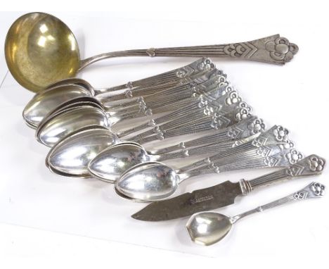 A set of 13 Danish silver dessert spoons, 8 Danish silver table spoons, a large Danish silver punch ladle, and 2 other pieces