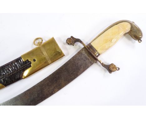 A 19th century Naval dirk, with gilt-brass hilt and ivory grips, original brass mounted leather scabbard, blade length 38cm 