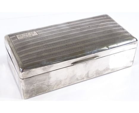 A large rectangular silver cigarette box, with engine turned lid, by Alexander Clark &amp; Co Ltd, hallmarks London 1927, len