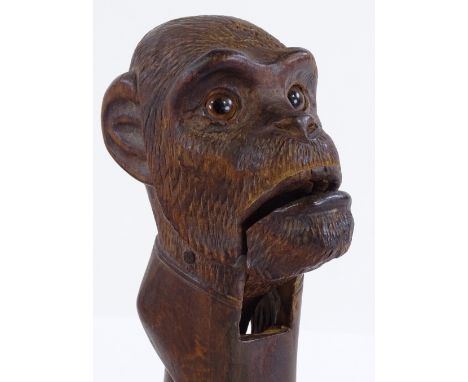 A 19th century Black Forest carved wood monkey design nutcracker, length 19cm 
