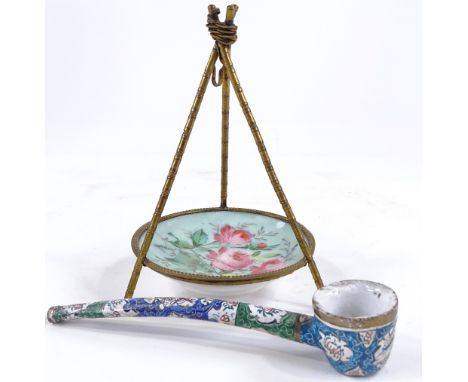 A 19th century gilt-brass pocket watch stand, in the form of a tripod, with porcelain panel, height 13cm, and a Middle Easter
