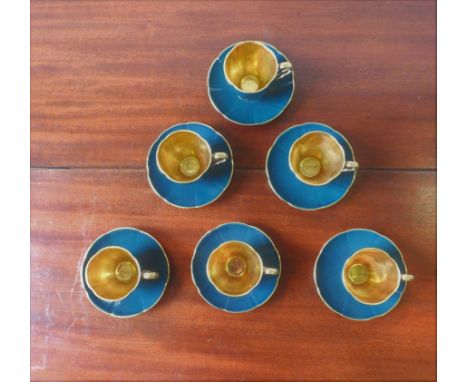 SIX CARLTONWARE GREEN GLAZE GILDED TEA CUPS WITH MATCHING SAUCERS 