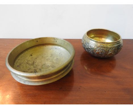 A HEAVY BRONZE CENSER AND AN EASTERN DECORATED BRASS BOWL, the censer 24.5cm dia 