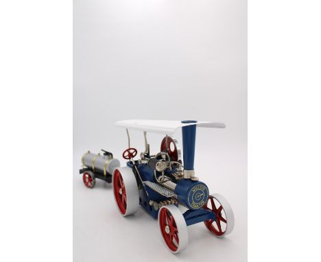 WILESCO LIVE STEAM ROLLER/TRACTION ENGINE, 30cm long, boxed as new with water cart trailer, 23cm long 