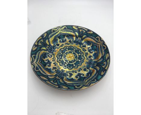 L. E. F. BODART ENAMELLED DELFT CERAMIC CHARGER decorated in tones of turquoise and blue with stylised designs, enriched with