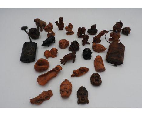 LARGE GROUP OF JAPANESE CARVED WOOD NETSUKE AND PENDANTS 20TH CENTURY together with TWO JAPANESE INRO'S, 20TH CENTURY (28) 