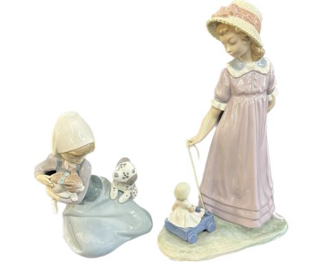 Two vintage Lladro figures to include a girl with a pull along dolly, a girl with a puppy and kitten, tallest measures approx