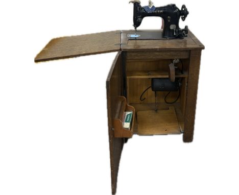 Singer cased sewing machine, cabinet measures approximately Height 31 inches, Width 21 inches, Depth 18 inches