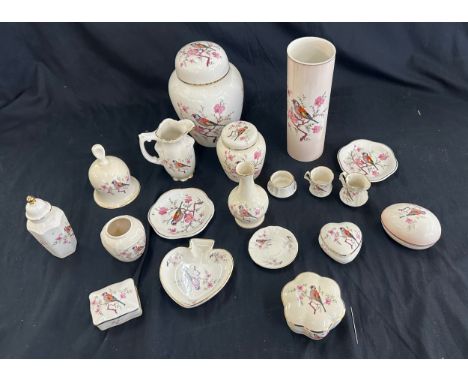 Selection of Royal Worcester Spode Palissy pattern porcelain items to include a lidded jar, vases, bell, small plates etc