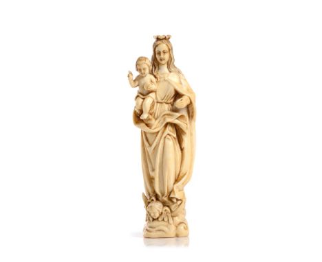 The Madonna and ChildNeo-gothic ivory sculptureDepicting the crowned Madonna holding the Child Jesus, resting on the lunar cr