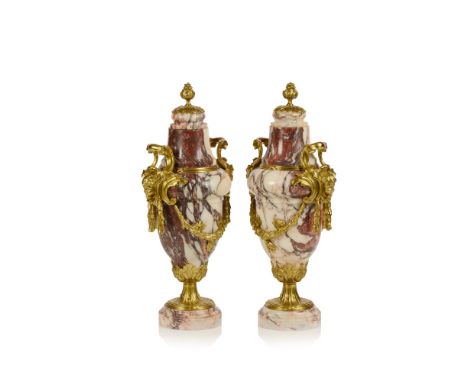 A pair of amphoraeMarble of applied gilt bronze decorative mountsFrance, 19th century Height: 52 cm 