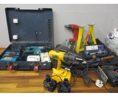 A quantity of DIY tools to include an SDS drill, a car jack, a Dewalt and spanners 