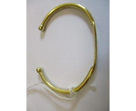 An 18ct gold bangle inscribed inform, 25.22 gms 
