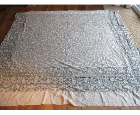 A 19th century Venetian lace bed cover with later alterations, 88" x 97", mounted on a cornflower blue coloured silk backgrou