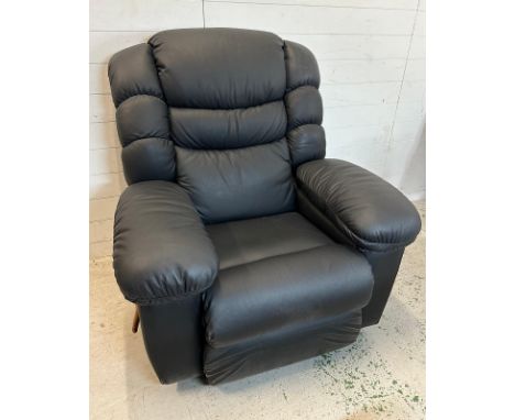 A black leather "Lazy Boy" manual reclining arm chair with massage function and fridge to arm Condition Report good condition