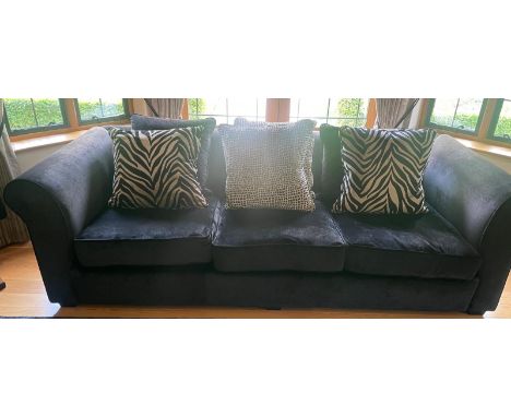 A contemporary black velvet four seater sofa (H80cm W260cm D120cm)