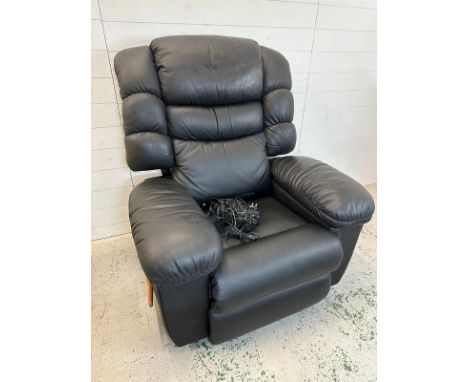 A black leather "Lazy Boy" manual reclining arm chair with massage function and fridge to arm 