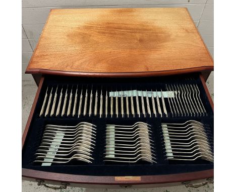 A mahogany two drawer canteen cabinet on legs, containing twelve place setting silver service by Carrs of Sheffield includes 