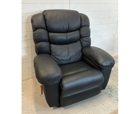 A black leather "Lazy Boy" manual reclining arm chair with massage function and fridge to arm Condition Report good condition