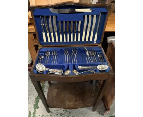 A cutlery table opening to silver plate flatware inside (H74cm W56cm D34cm)