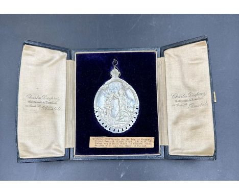 A mother of pearl medallion retailed by Charles Desprez of Bristol in blue leather easel backed leather display case.