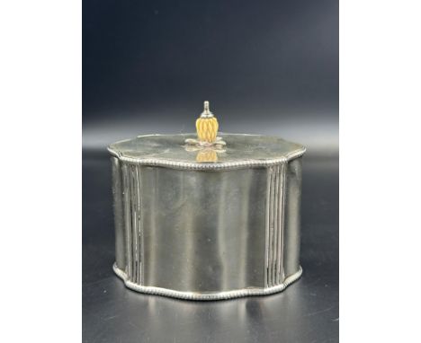 A hallmarked silver tea caddy, hallmarked for London 1911, approximate weight 240g.