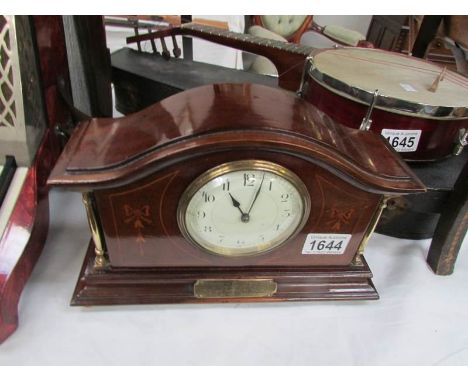 An inlaid mantel clock with brass presentation plaque "Presented to PC C R Spencer by the officers and mend of the 'Y' Divisi