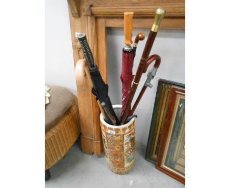 An oriental style stick stand with sticks