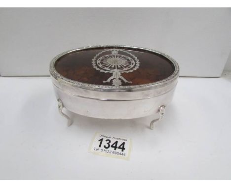 A large silver plated trinket pot with inlaid faux tortoiseshell lid