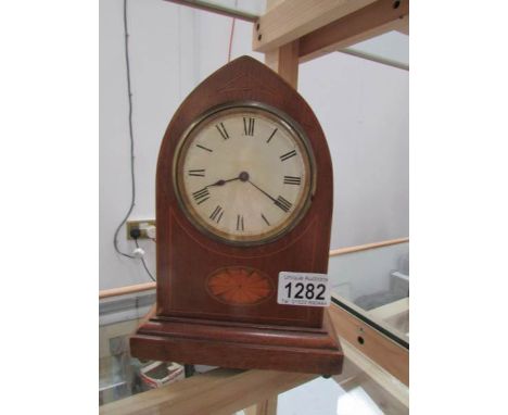 A mahogany inlaid arched top mantel clock